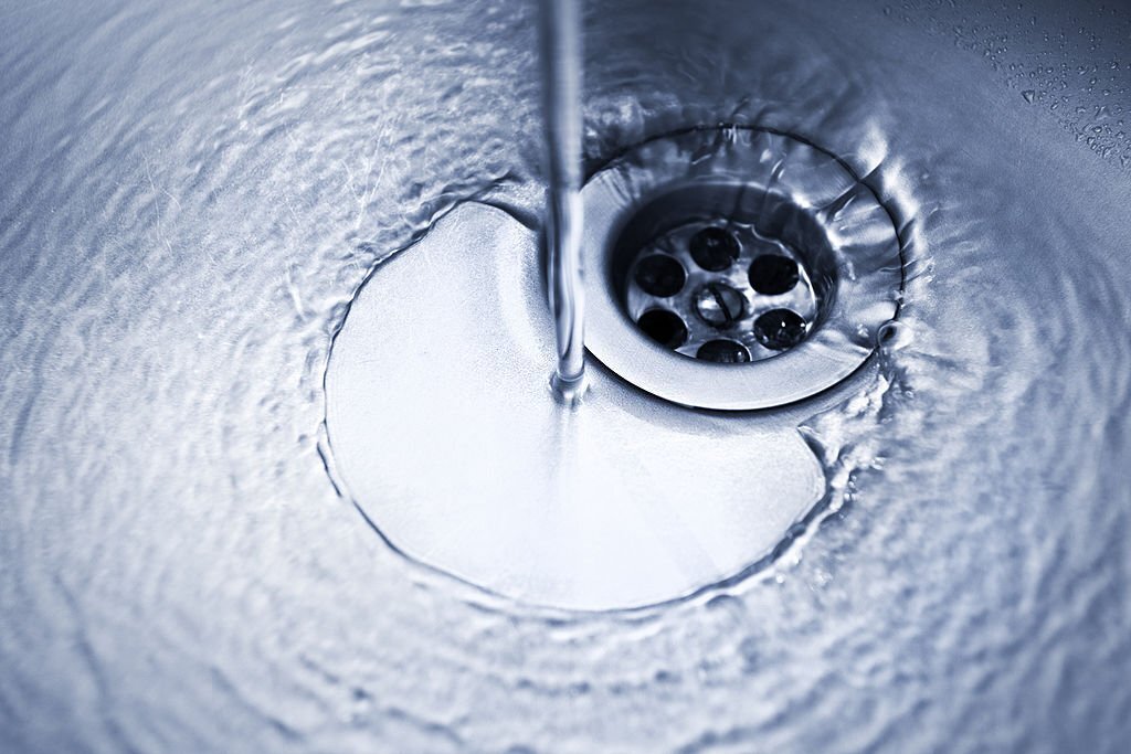 drain with waterrunning kitchen faucet (darker variation shot)running kitchen faucet
