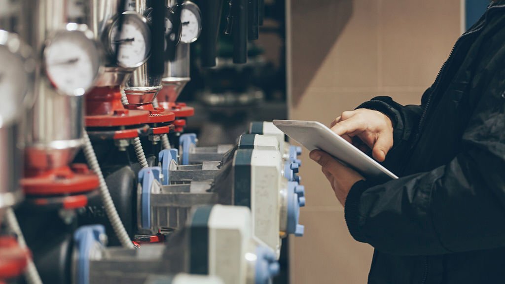 engineer working on maintenance in boiler room